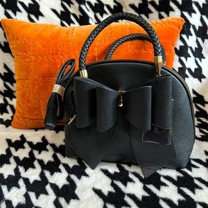 Large bow handbag